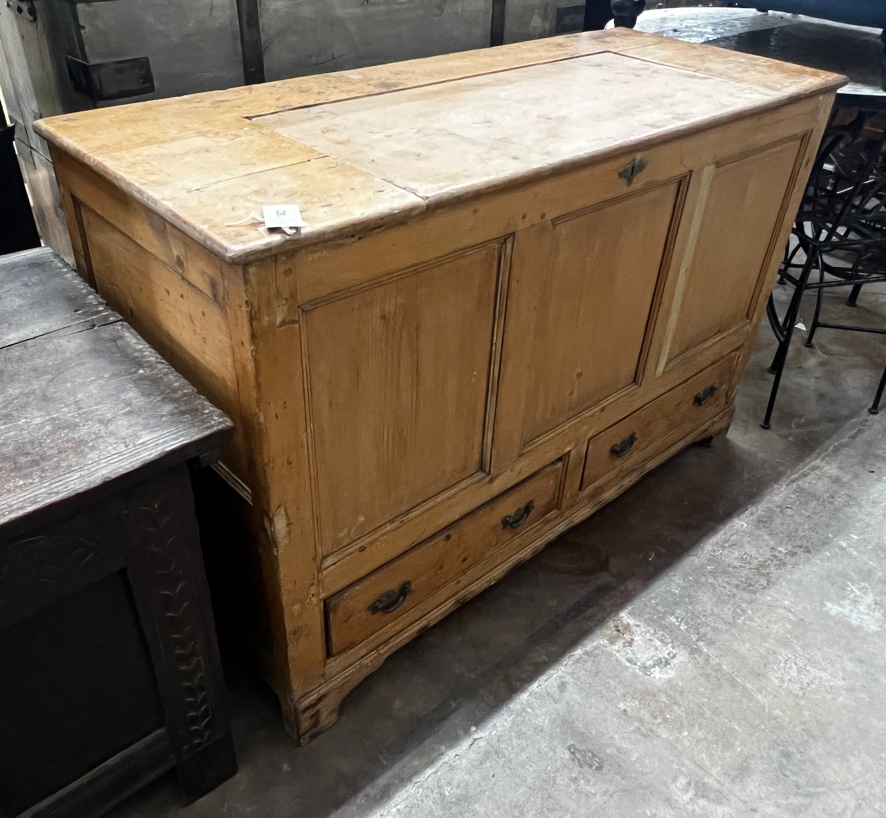 An early 19th century pine mule chest, the hinged top adapted, width 124cm depth 51cm height 80cm